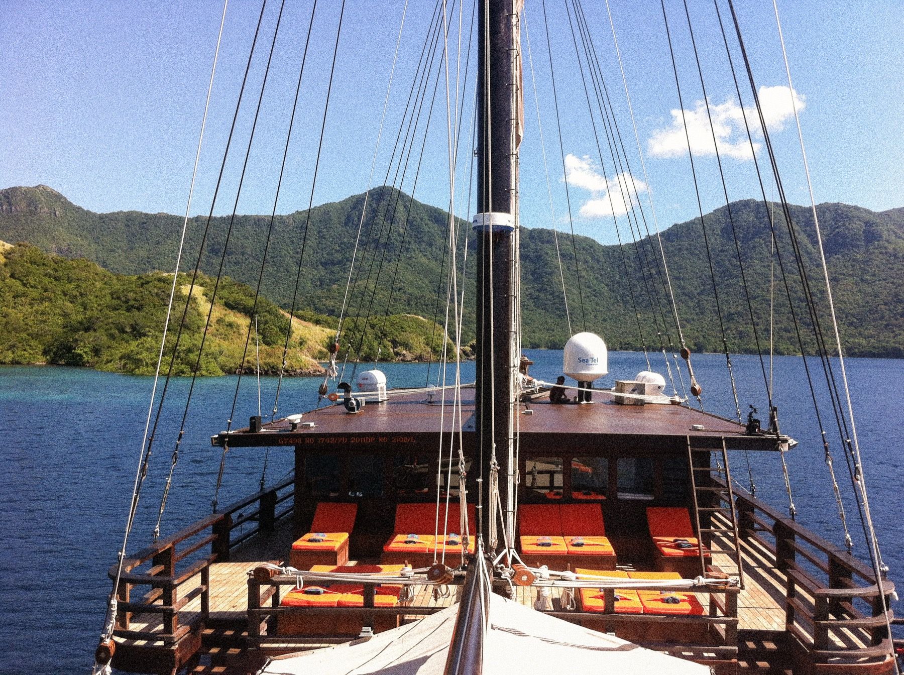 Waow 2's foredeck lounge, anchored in a quiet bay.
