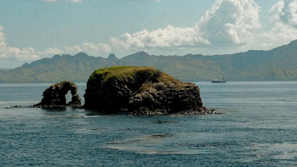A rock arch in the sea at Komodo.