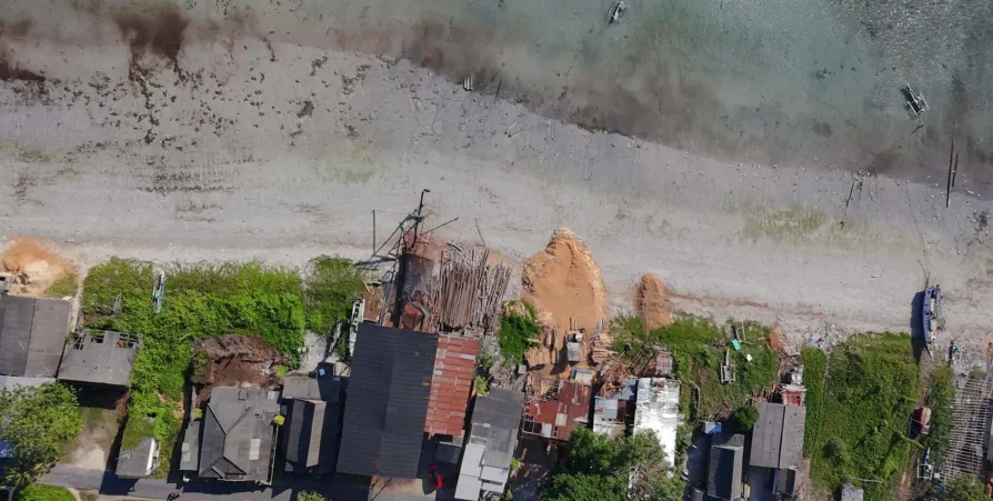 Aerial view of the shipyard buildings along the beach at Bira