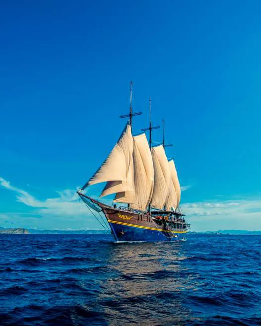 The original WAOW under sail on a deep blue sea