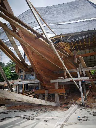 The wooden hull and its supports seen from below