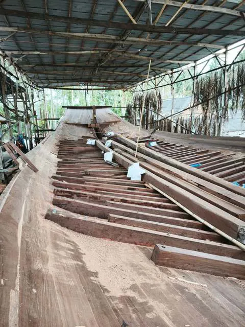 Ribs and planks along the keel inside the shed