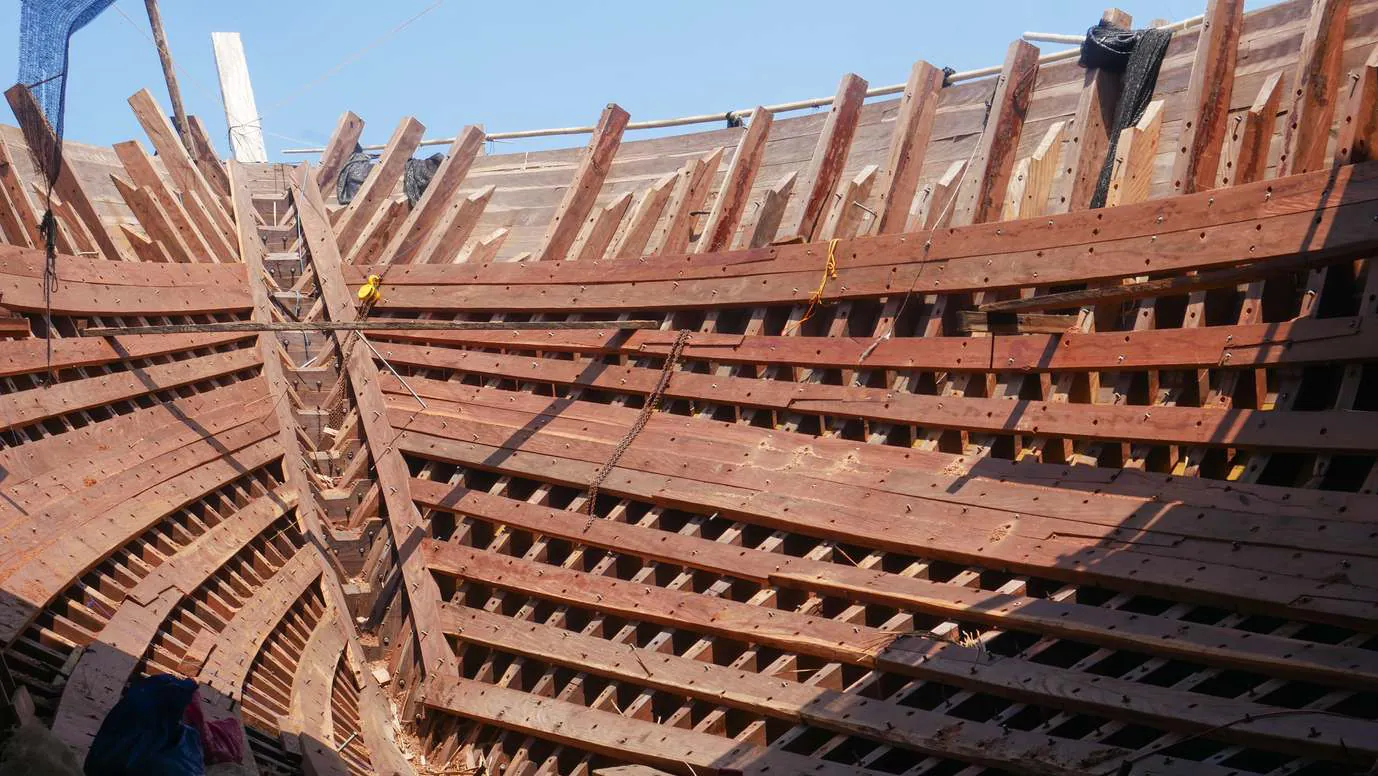 The hull of WAOW 2 seen from inside, ribs and stringers in the sun