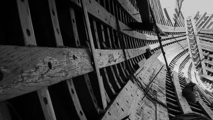 Black-and-white close-up of the hull's ribs and stringers