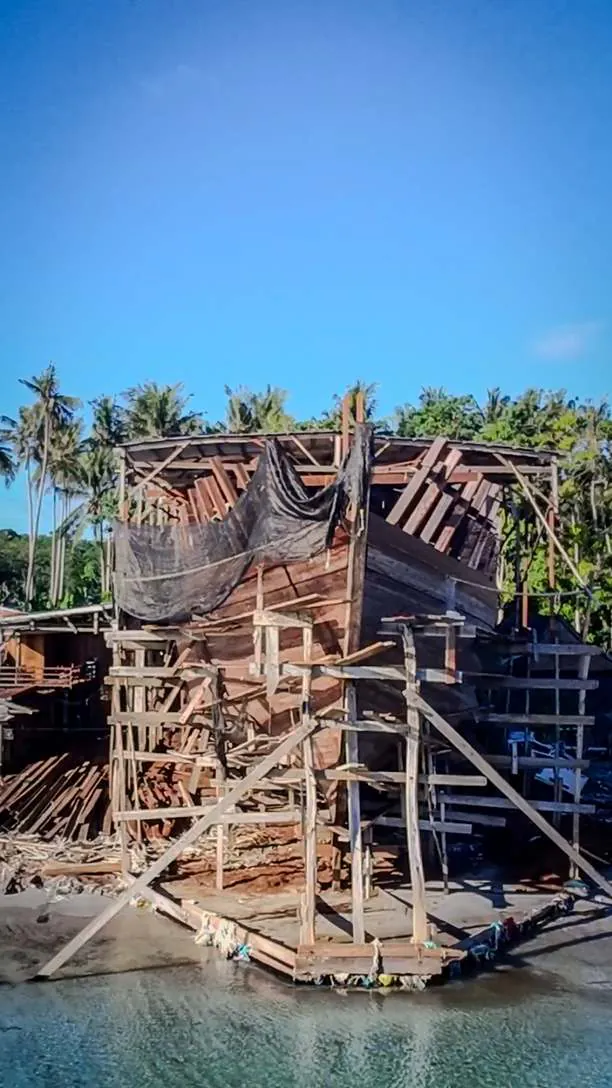 The hull of WAOW 2 in scaffolding on the shore, eight months after keel laying
