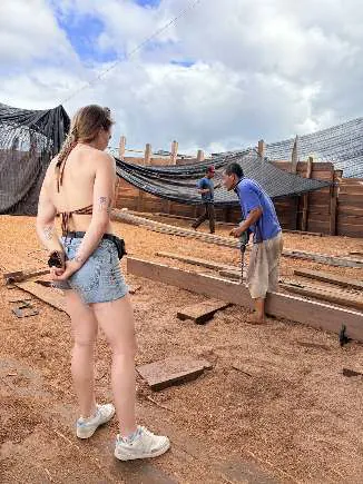 Camille watching a craftsman working on the deck of WAOW 2