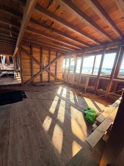 Sunlight falling through the windows onto the wooden floor of a new space on the main deck